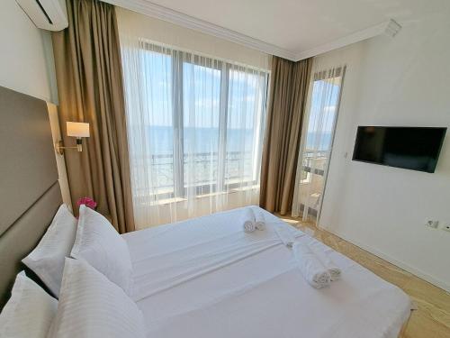 Ένα ή περισσότερα κρεβάτια σε δωμάτιο στο Onyx Private Apartments