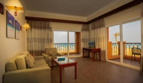 a living room with a couch and a table at La Rosa Empire Hotel-Ain Sokhna in As Suways