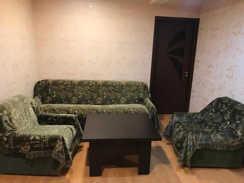 a living room with a couch and two chairs and a table at Remember Me B&B in Dilijan