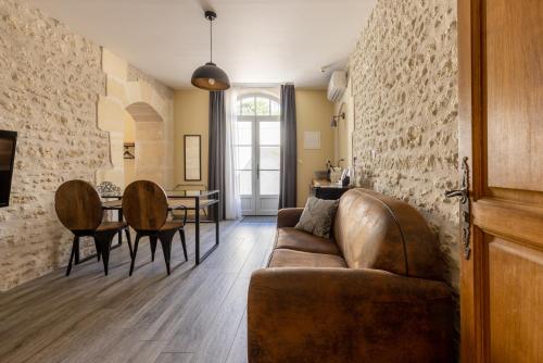 a living room with a couch and a table at Château Pellisson in Cognac