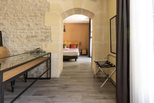 a hallway with a room with a bed at Château Pellisson in Cognac