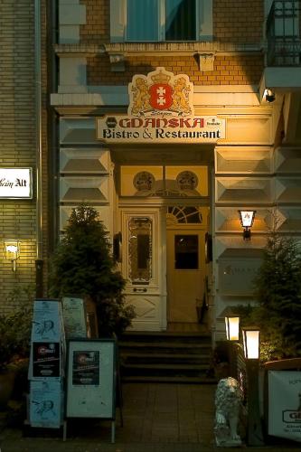 a building with a sign on the front of it at Hotelik Gdanska in Oberhausen