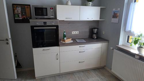 Kuchyň nebo kuchyňský kout v ubytování Ferienwohnung Ernebibbel