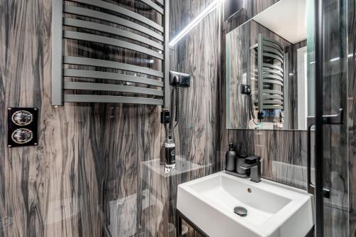 a bathroom with a sink and a mirror at The Homeboat Company Sant'Elmo-Cagliari in Cagliari