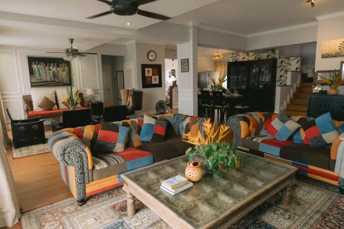 a living room with couches and a coffee table at Petronella Luxury Penthouse marina court in Kota Kinabalu