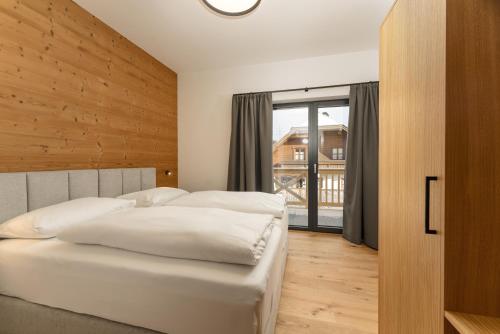 Ένα ή περισσότερα κρεβάτια σε δωμάτιο στο Pure Alpine Suites