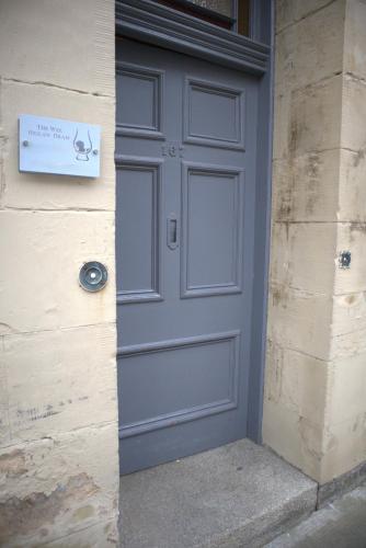 a blue door on the side of a building at The Wee Heilan' Dram in Keith
