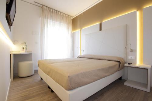 Postel nebo postele na pokoji v ubytování Hotel Toledo
