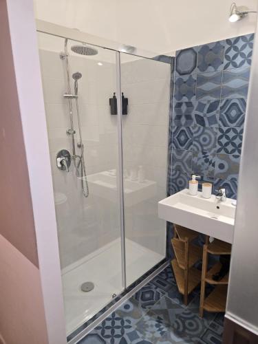 a bathroom with a shower and a sink at Il Faro Trapani b&b Rooms & apartments in Trapani