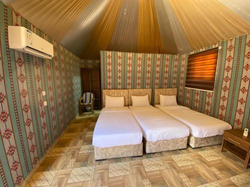 a bedroom with a bed in a room at Lowrance luxury camp in Wadi Rum