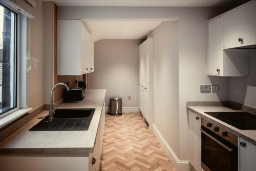 a kitchen with a sink and a counter top at George Florence House in Spennymoor
