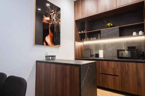 a kitchen with a counter and a microwave at Royal Central Apartments in Zagreb