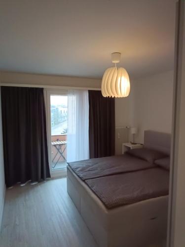 Una cama o camas en una habitación de Modernes Apartment in Basel-Stadt