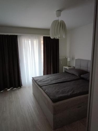 Una cama o camas en una habitación de Modernes Apartment in Basel-Stadt