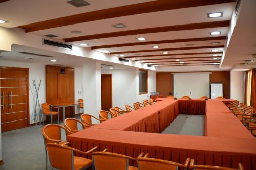a large room with a long table and chairs at Hotel Millennium in Pogradec