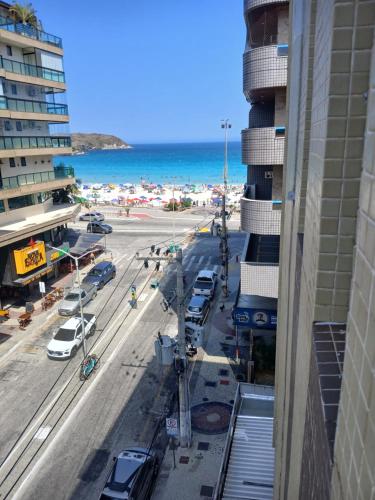 a view of the beach from a building at Apartamento in Cabo Frio