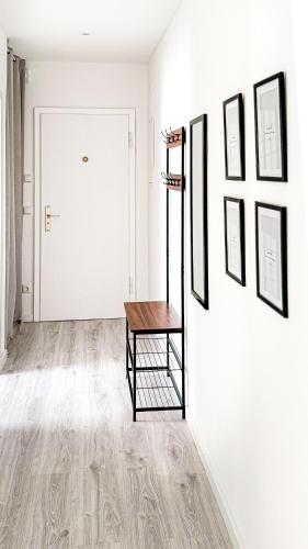 a hallway with a table and pictures on the wall at 2 ZKB-3OG oder 3 ZKB-UG im Zentrum zw Rathaus und Dom in Augsburg