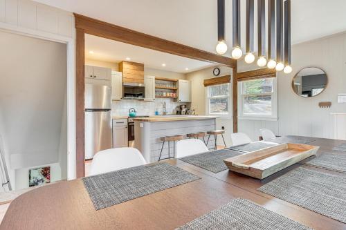 a kitchen and dining room with a table and chairs at Fireside Lodge A-Frame in Bryce Resort with Decks in Basye