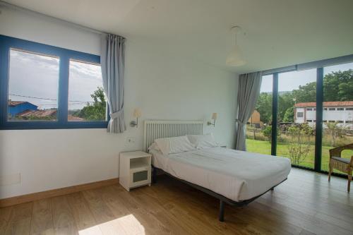 Ένα ή περισσότερα κρεβάτια σε δωμάτιο στο Chalet playa de Celorio