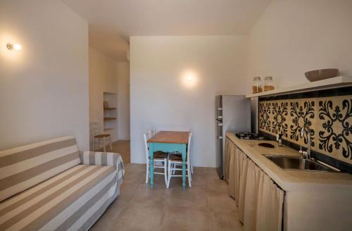 a kitchen with a sink and a counter top at Podere Santa Chiara in Otranto