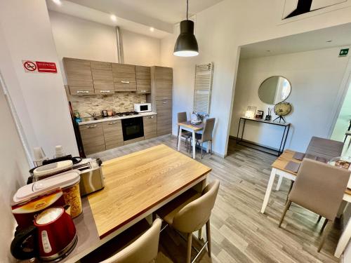 a kitchen and dining room with a table and chairs at Enjoy Vatican in Rome
