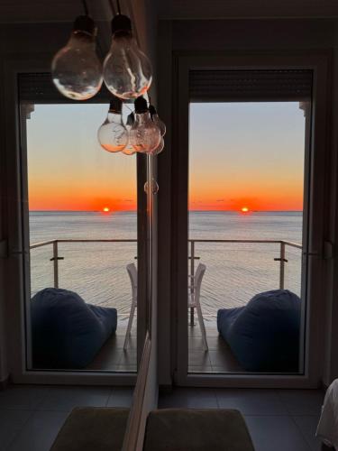 a view of the ocean from a room with a window at Deluxe Apartments Shengjin in Shëngjin