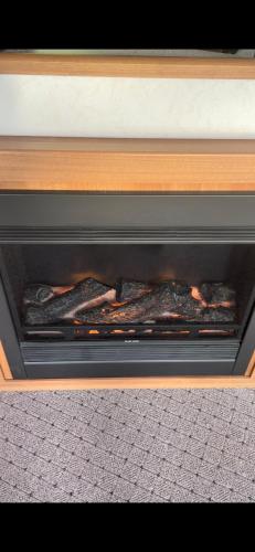 a fireplace with some food inside of it at 1 Gullion Lodge Newry in Newry