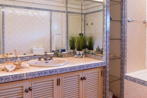 a bathroom with a sink and a mirror at The Princess Ring View in Vila Franca do Campo