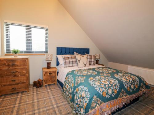 a bedroom with a bed and a wooden dresser at The Oak Room - Windmill Country Retreats in Melton Mowbray