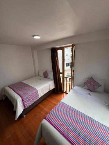 Golden Paris Hotel "Caminos del InKa 2025"にあるベッド