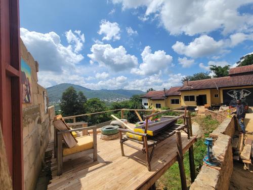 a deck with a hammock on top of a house at EMMY'S HIDE AWAY in Iringa