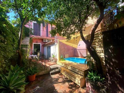 a swimming pool in the backyard of a house at La Siciliana in Acireale