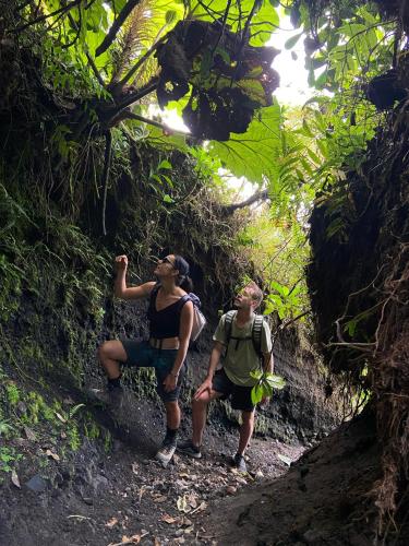 two people on a trail in the jungle at Hostal Xilotl in San José del Sur