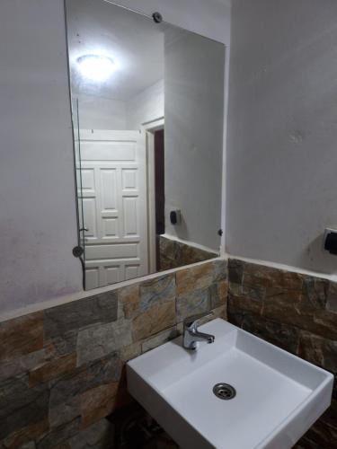 a bathroom with a sink and a mirror at hostel Banana in Tangier