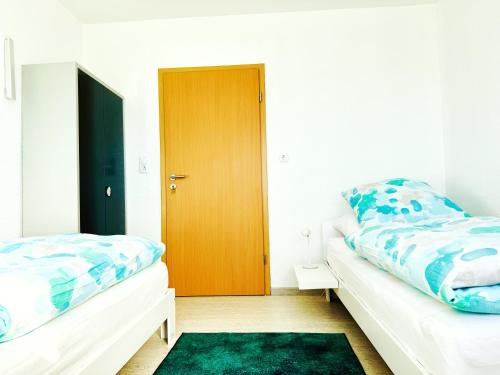 Katil atau katil-katil dalam bilik di EG Wohnung 24 h Self Check In