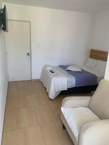 Ένα ή περισσότερα κρεβάτια σε δωμάτιο στο Paracas Guest House