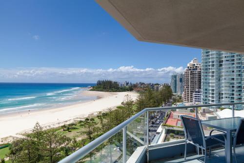a balcony with a view of the beach and ocean at Points North Apartments in Gold Coast