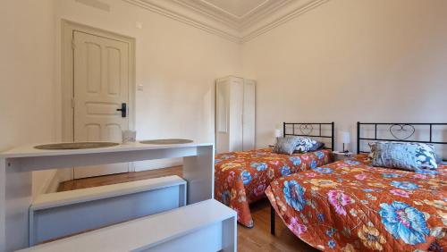 Ένα ή περισσότερα κρεβάτια σε δωμάτιο στο MINI HOST in LISBON