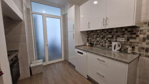 Η κουζίνα ή μικρή κουζίνα στο MINI HOST in LISBON