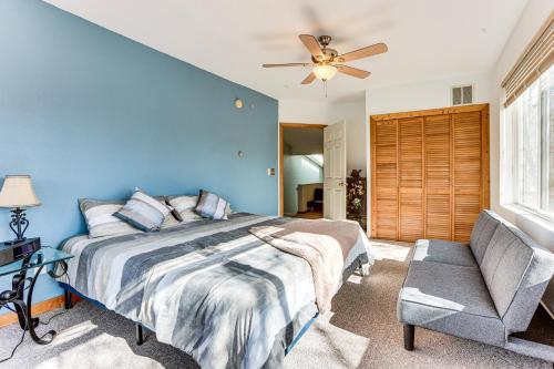 a blue bedroom with a bed and a ceiling fan at Ice Fish, Hunt and Explore Farwell Home on Lake in Farwell
