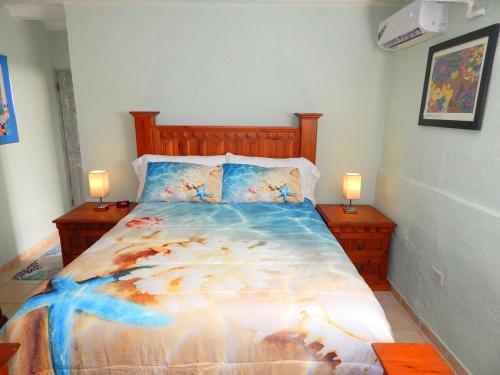 a bedroom with a large bed with two night stands at Sea Breeze Retreat 301 in Puerto Peñasco