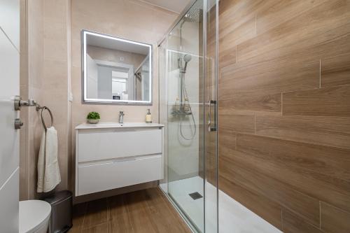 a bathroom with a shower and a sink and a toilet at Sunset Vibes Mijas in La Cala de Mijas