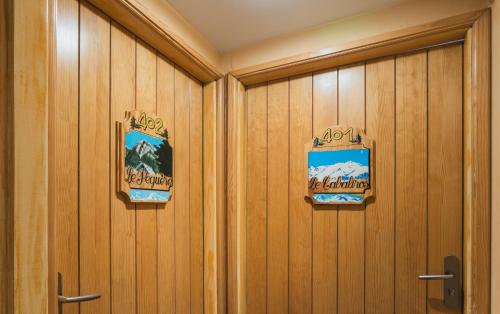a row of wood panels in a locker room at Hôtel Le Bois Joli in Cauterets