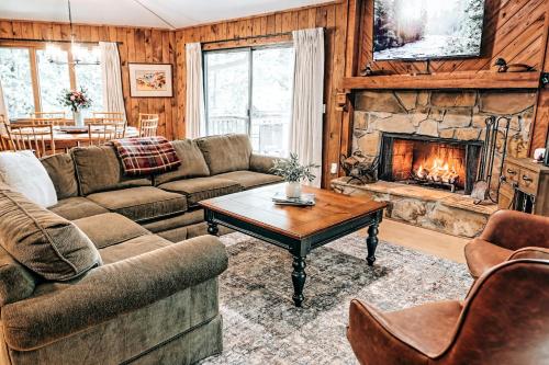 a living room with a couch and a fireplace at Serenity Ridge in Dillard