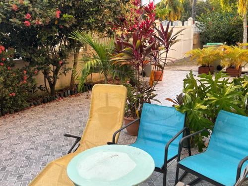 a table and two chairs and a table and chairs at studio sympa in Port-Louis