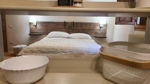 a bedroom with a large bed and a bath tub at Stirpe nel Bosco - Fiocco in Montevettolini