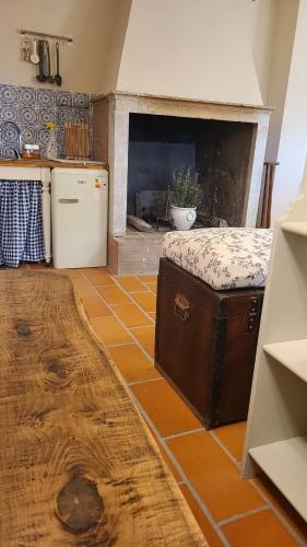 a kitchen with a stove and a counter in a room at Stirpe nel Bosco - Fiocco in Montevettolini