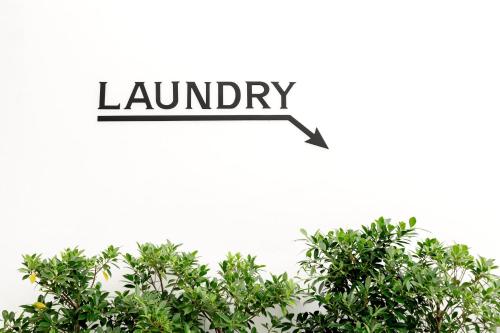 an illustration of a lemon tree with the word laundry at Grand Sattahip Hotel by BSH in Ban Nong Sa