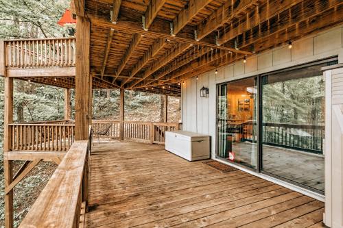 a wooden deck with a bench on a house at Serenity Ridge in Dillard