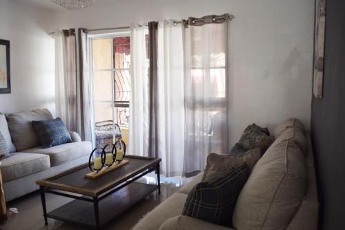 a living room with a couch and a coffee table at Relax in this apartment in Santiago de los Caballeros